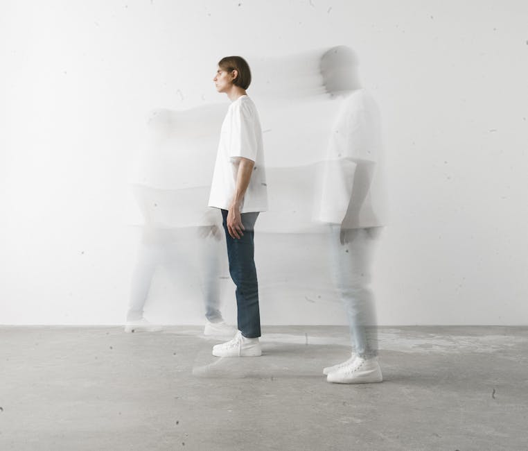 Ethereal long exposure shot of a person moving indoors, creating a ghostly effect.